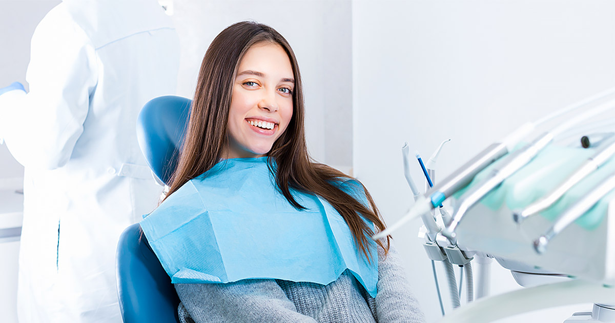 Young woman smiling at the dentist