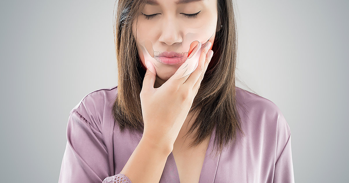 woman with jaw pain and skeletal overlay on jaw area