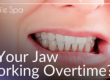 female holding jaw in pain
