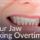 female holding jaw in pain